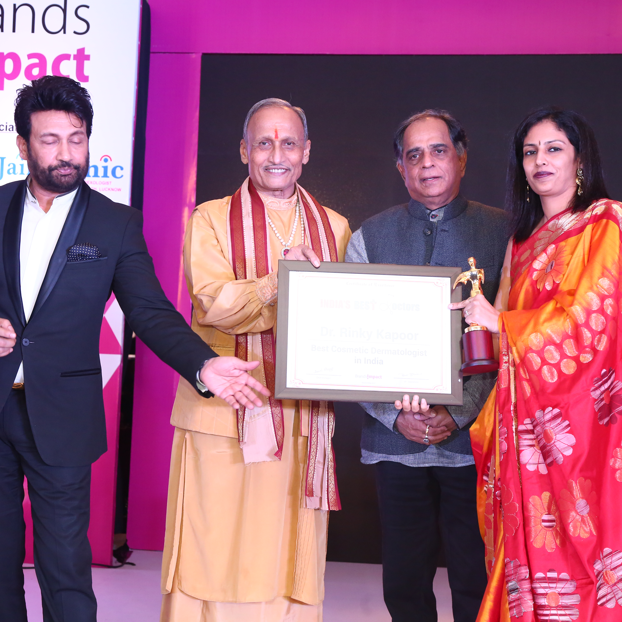 Dr. Rinky Kapoor receiving Best Dermatologist award on stage